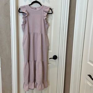 Pink cotton dress with pockets and ruffle details